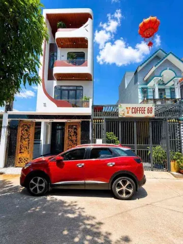 Nhà đẹp TT đông hòa ngay chợ dĩ an.DT 100M2(5×20)full ĐG xe hơi
